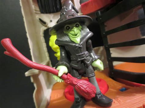 Add a touch of magic to playtime with the Witch Accessories Playset by Fisher Price